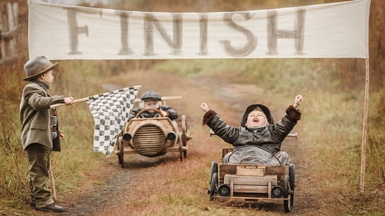 Finish the race between two boys in homemade cars