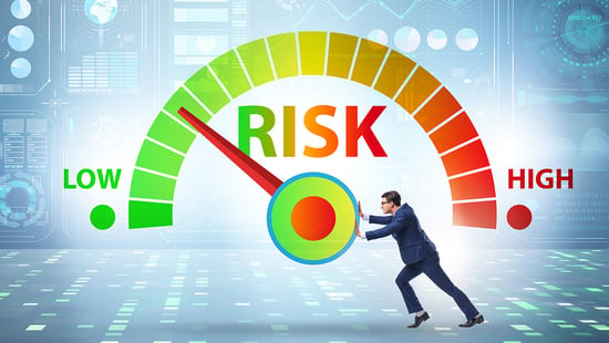 Man moving the risk needle from high to low