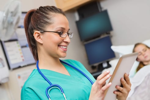 Nurse with iPad and Patient - Compressed.jpg